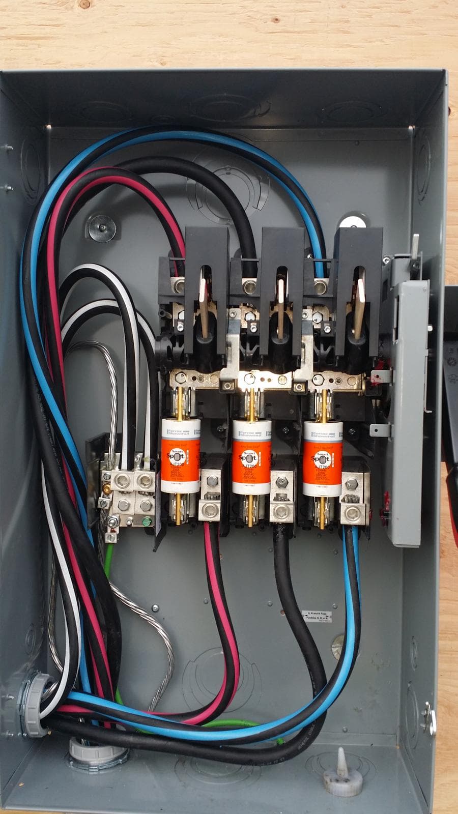 Calgary electrician outdoor disconnect panel wiring installation with fused switches