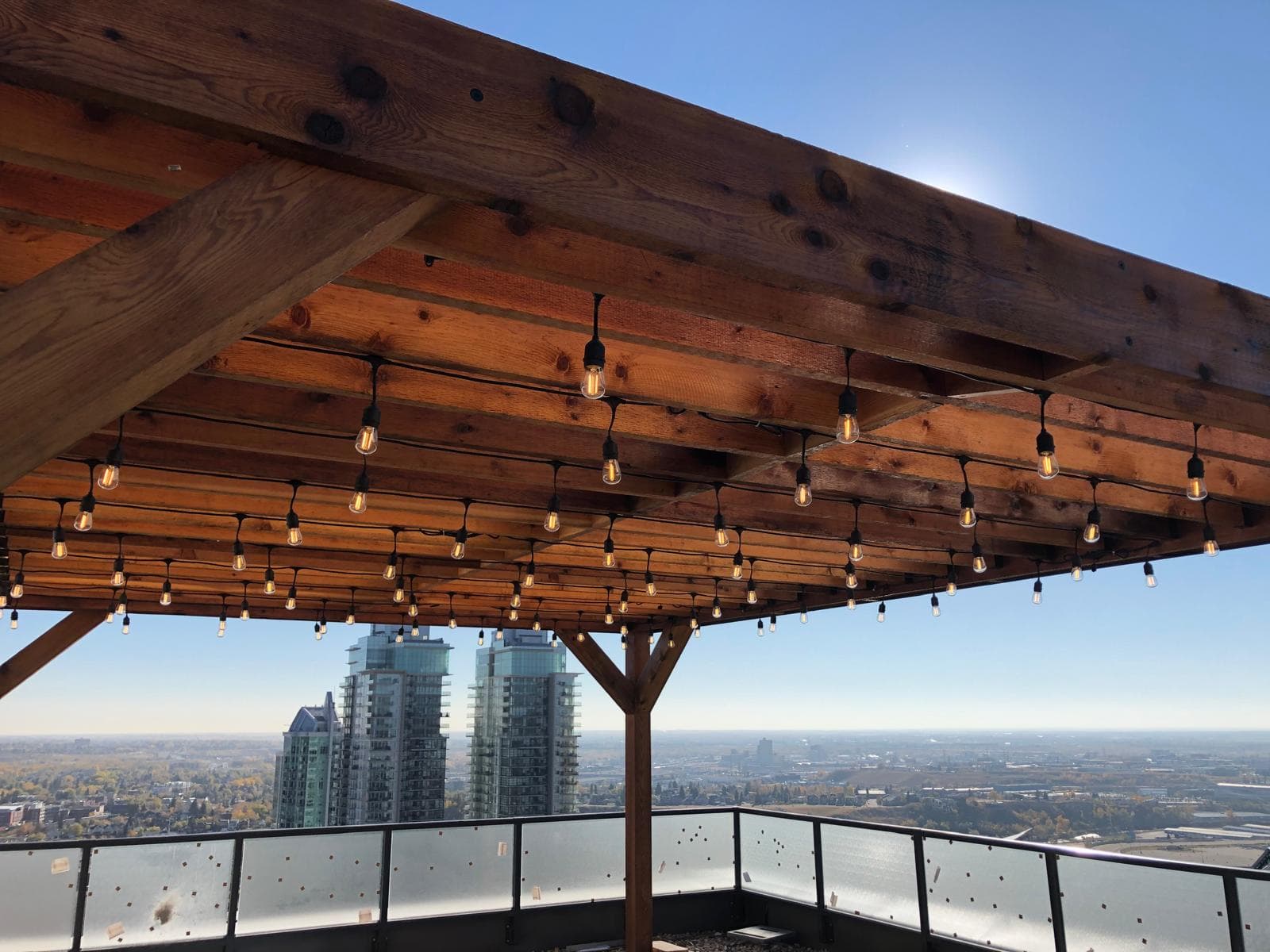 Calgary electrician rooftop patio Edison string light installation